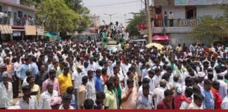 Anjinappa Puttu leads supporters in a march through the town to protest the alleged sale of the Sidlaghatta constituency seat