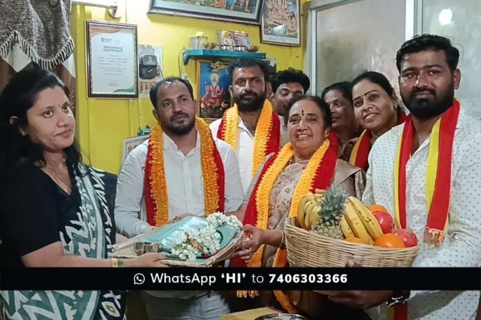 KRV Simha Sene activists honoring CMC G. Amrutha with a silk saree and traditional plate