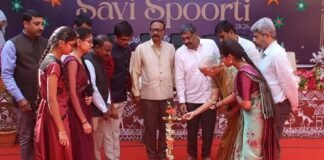 Dr. B.T. Lalitha Nayak addressing young students at Dolphins PU College, Sidlaghatta