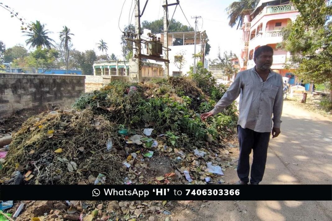 Shamanna Bavi with waste pile on the adjacent road