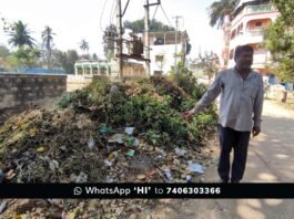 Shamanna Bavi with waste pile on the adjacent road