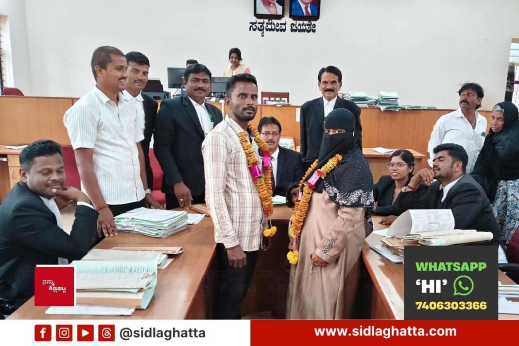 Couple reunited by National Lok Adalat with court officials and lawyers, Sidlaghatta court premises