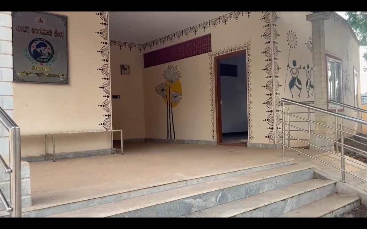 Entrance of Bodaguru anganwadi centre decorated with Warli art and floral paintings