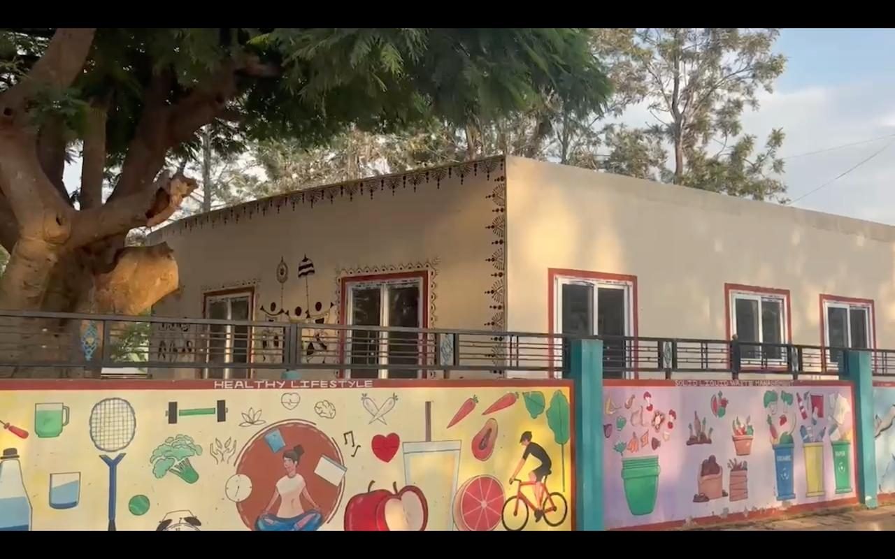 Healthy lifestyle paintings on the compound wall of Bodaguru anganwadi centre