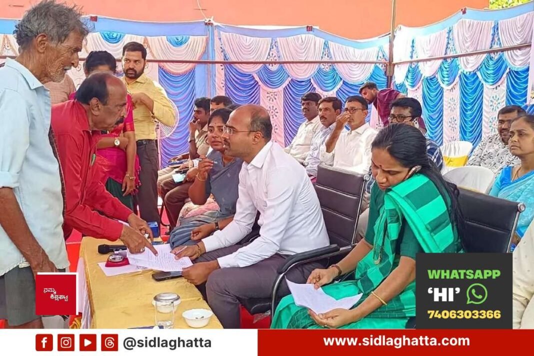 Officials receiving public applications at Prajaseva Andolana in Jangamakote hobli, Sidlaghatta