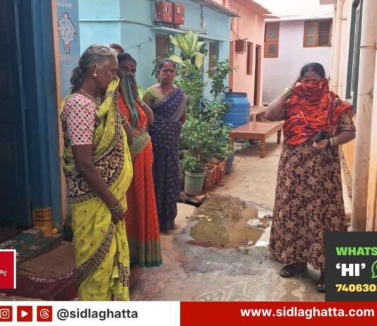 Residents covering their faces from the stench of overflowing UGD sewage water near Garden Road, Ward 3, Sidlaghatta