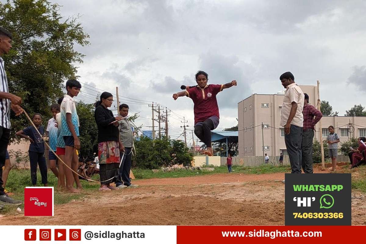 Girl student attempting the long jump at the taluk-level school athletics meet