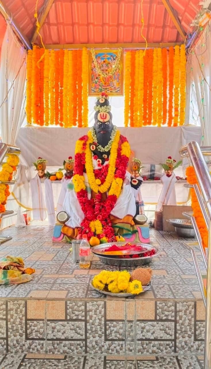 Sidlaghatta Maharshi Valmiki stone statue decorated with flowers