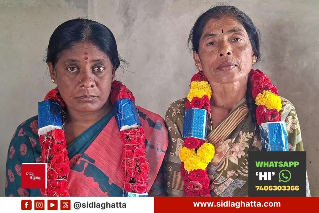 Newly elected president Nalina and vice president Muniratnamma of women milk producers cooperative society